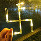 Detailed view of string lights with hanging props for festive decor.